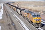 Loaded coal train climbs upgrade